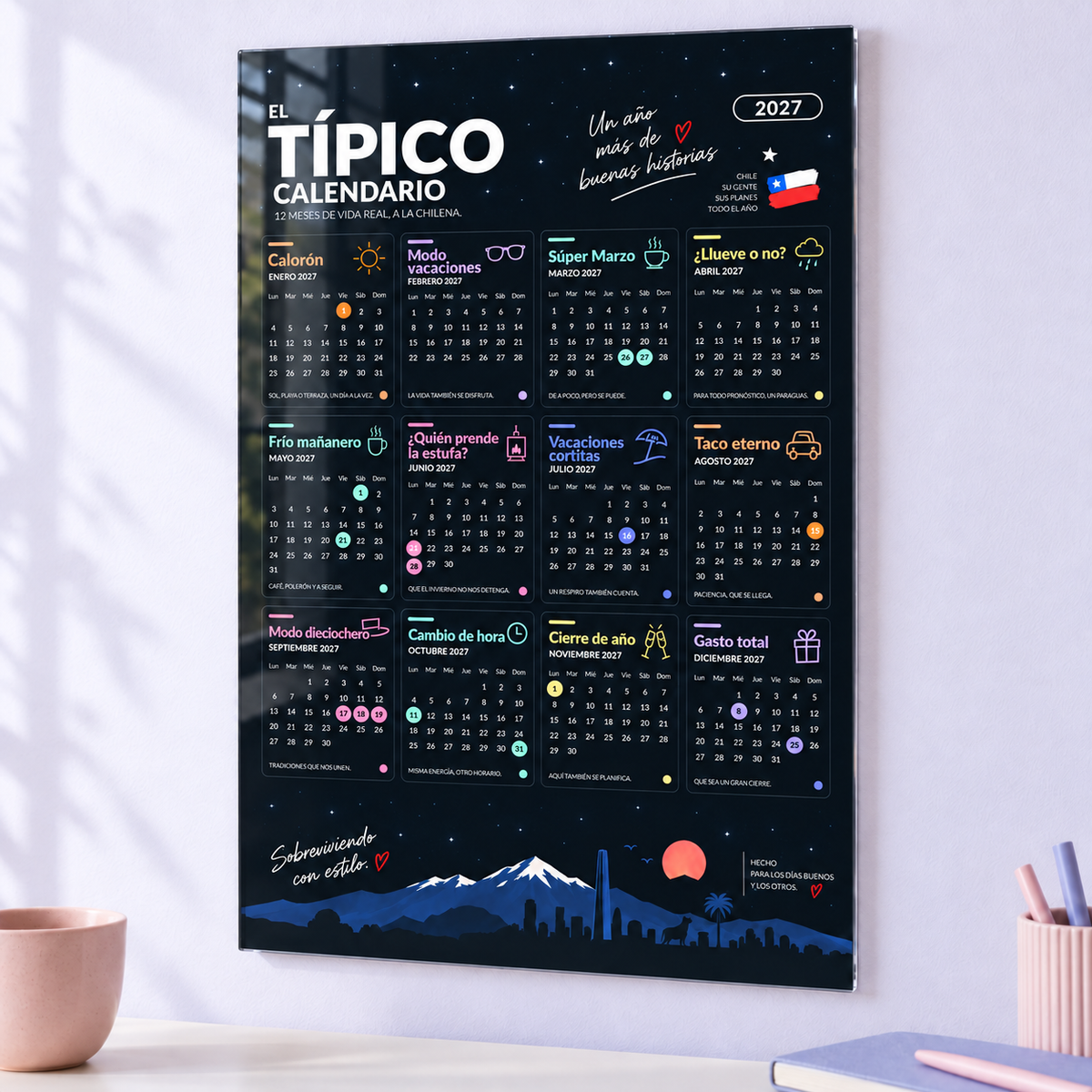 El típico calendario 2027 en acrílico para pared, con el diseño completo y la frase inferior derecha.